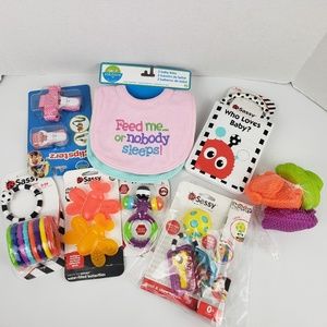 7 Assorted Sassy toys and Two Neat Solution Bibs- Girl